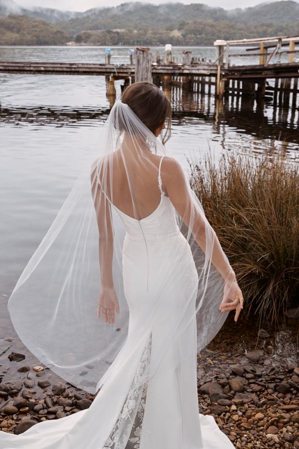 CONNOR-ML20025-FULL-LENGTH-CREPE-GOWN-WITH-V-NECKLINE-THIN-STRAPS-LACE-APPLIQUES-SCOOP-BACK-ZIPPER-CLOSURE-WEDDING-DRESS-MATCHING-VEIL-MADI-LANE-BRIDAL-10